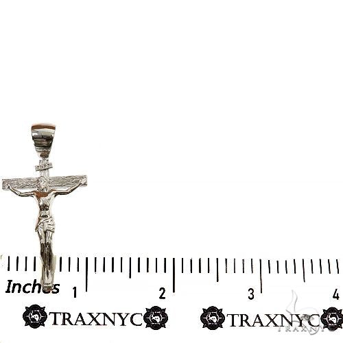 Silver Jesus crucifix pendant with detailed Franco chain necklace.