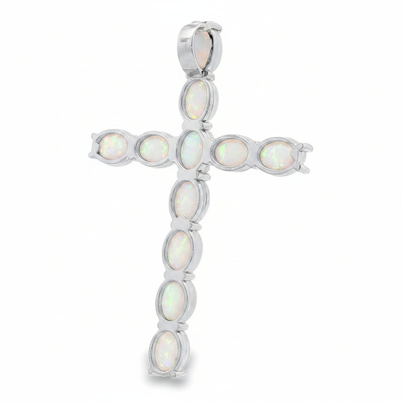 Silver cross pendant set with opal stones in prong settings