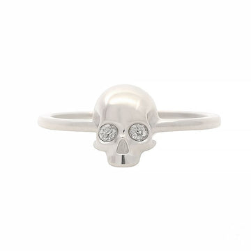 Sterling silver skull ring with diamond eyes and minimalist band design.