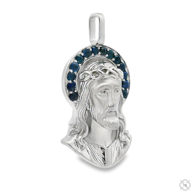 Silver Jesus pendant with detailed halo of blue stones around the head
