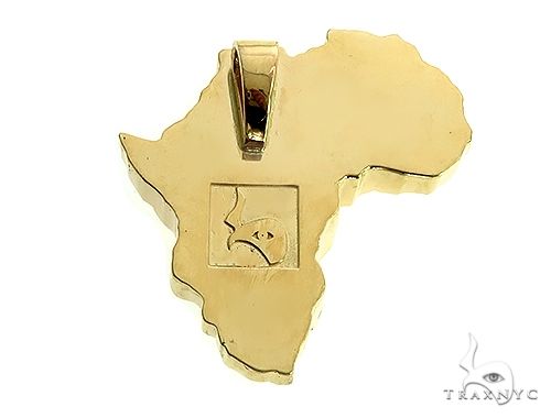Yellow gold pendant shaped like Africa with a lion face detail in the center