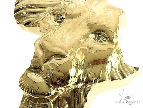 Small yellow gold lion face pendant with detailed mane and facial features for men