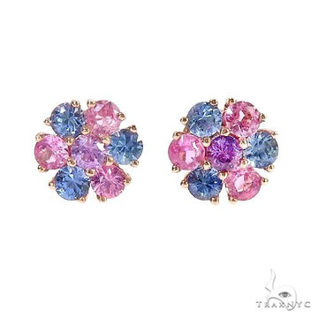 Small flower cluster stud earrings with pink and blue gemstones in gold setting.