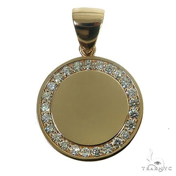 Small round yellow gold pendant with diamond halo and smooth center plate.