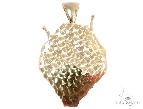 Yellow gold lion head pendant with textured diamond-cut surface and smooth bail