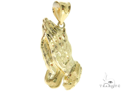 Yellow gold pendant shaped as praying hands with detailed fingers and cuffs