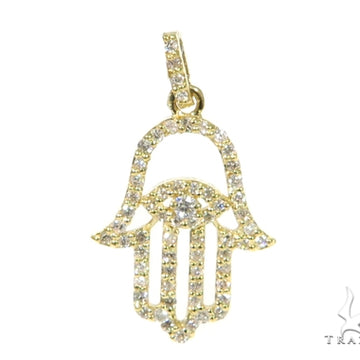 Small yellow gold Hamsa pendant encrusted with diamonds.