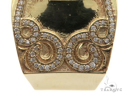 Yellow gold ring with detailed crown design and pavé diamond-encrusted dome center