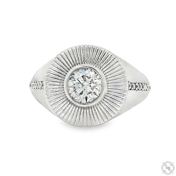 Silver men's ring with central diamond and textured sunburst design around it.