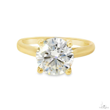 Cathedral solitaire engagement ring with round brilliant lab-grown diamond in yellow gold four-prong setting