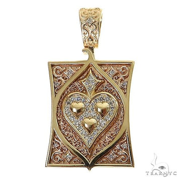 Yellow gold spade card pendant with diamond accents and intricate filigree detailing.