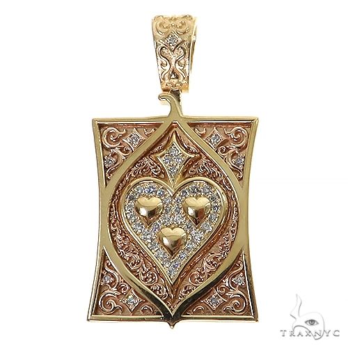 Yellow gold spade card pendant with diamond accents and intricate filigree detailing