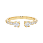 Yellow gold open ring with two central diamonds and smaller diamonds along the band.