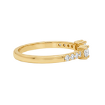 Yellow gold open ring with central diamond and smaller side diamonds on the band.