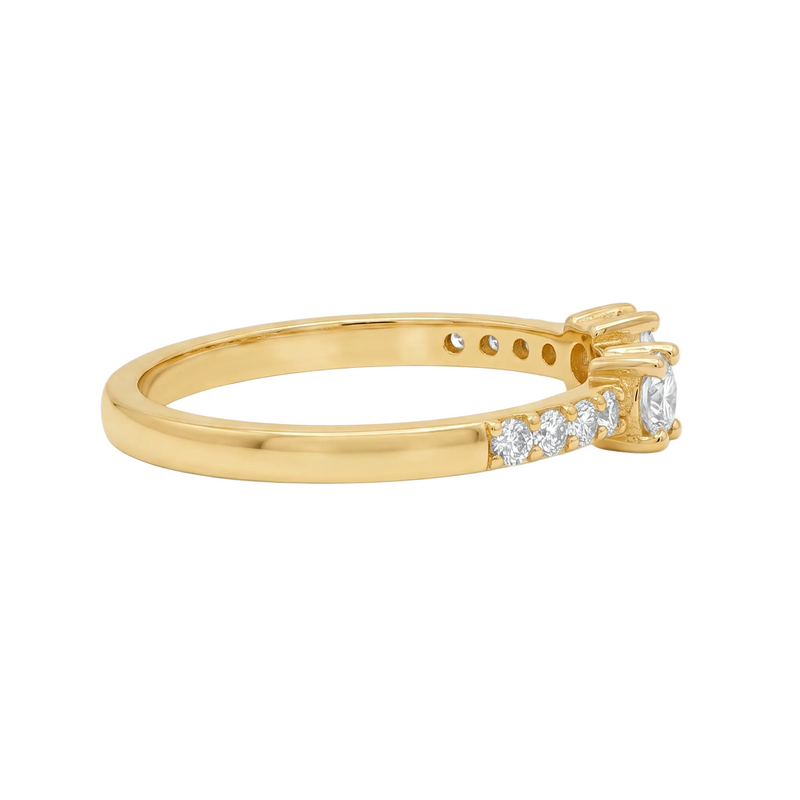 Yellow gold open ring with central diamond and smaller side diamonds on the band.