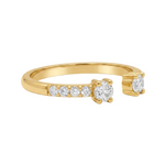 Yellow gold open ring with two diamonds and five smaller diamonds on one side.