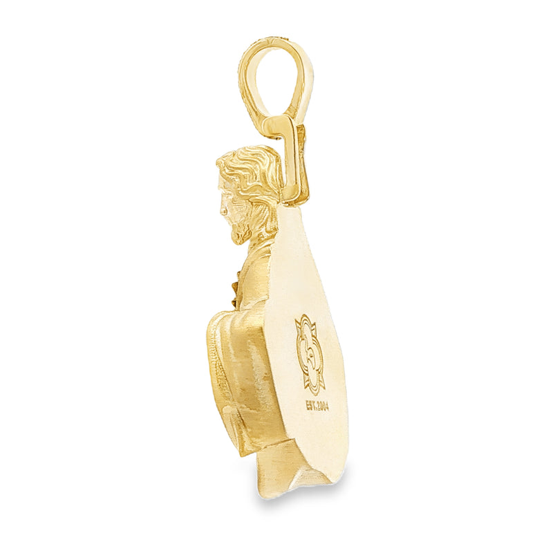 Yellow gold Sacred Heart Jesus pendant with diamond-accented bail.