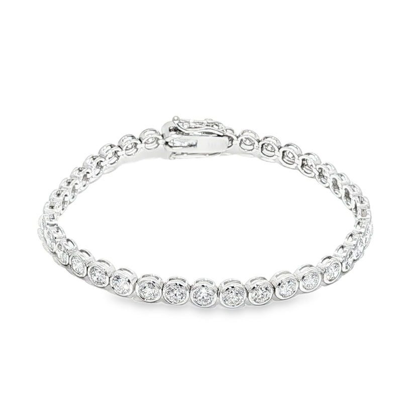 White gold bezel set tennis bracelet with round diamonds and secure clasp.