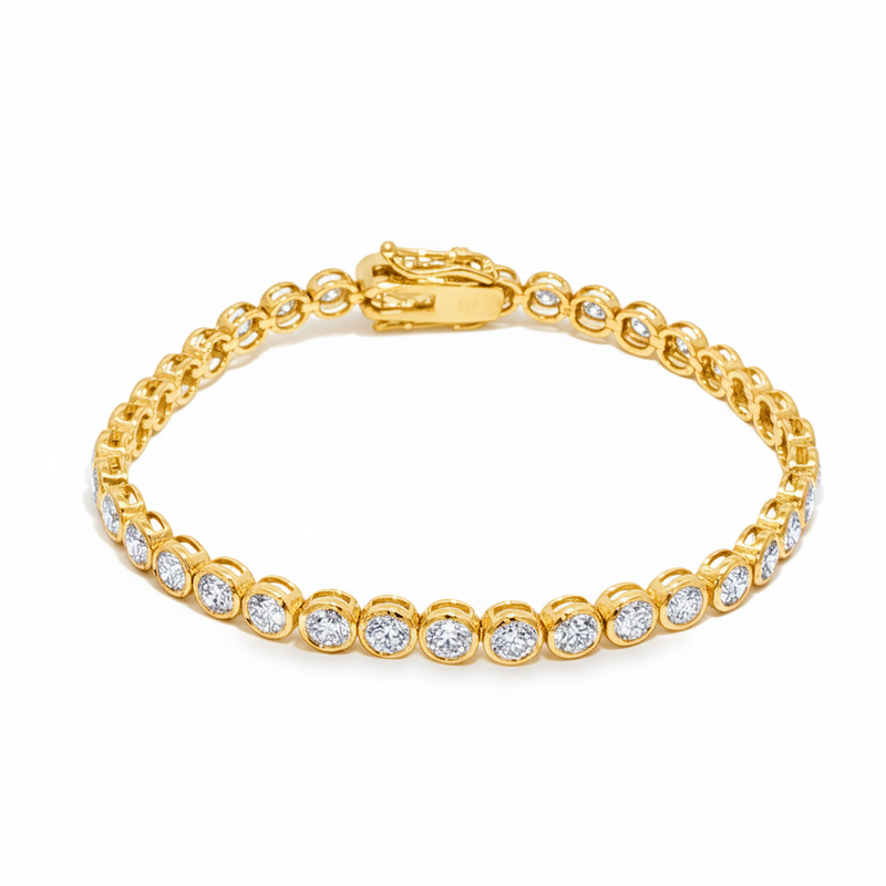 White gold bezel set tennis bracelet with round diamonds and secure clasp.
