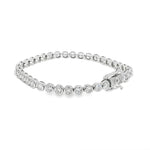 White gold bezel set tennis bracelet with round diamonds and secure clasp.