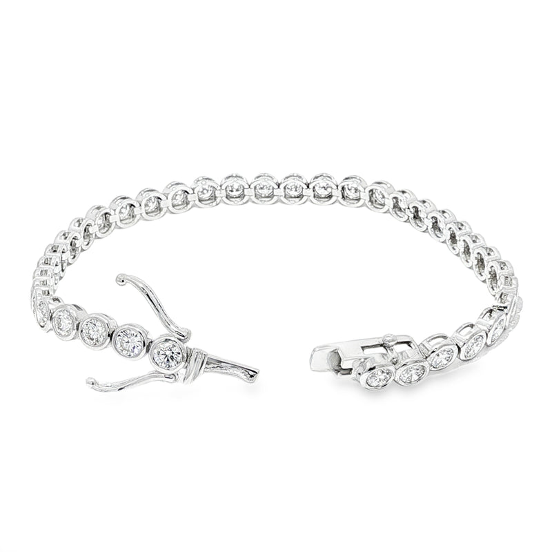 White gold bezel set tennis bracelet with round diamonds and secure clasp.