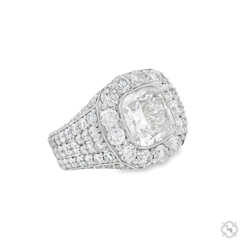 White gold men's ring with large square diamond surrounded by multiple smaller diamonds