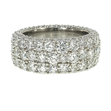Wide white gold band ring with three rows of sparkling round diamonds.