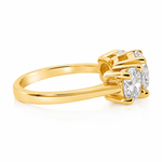 Sophia round three stone lab grown diamond engagement ring in 14K yellow gold with a 2 carat round center diamond, two 0.70 carat round side stones, and a polished 2.00mm band.