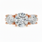 Sophia round three stone lab grown diamond engagement ring in 14K gold with a 2 carat round center diamond, two 0.70 carat round side stones, and a polished 2.00mm band.