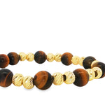 Adjustable men's bracelet with polished tiger eye and textured gold beads on black cord.