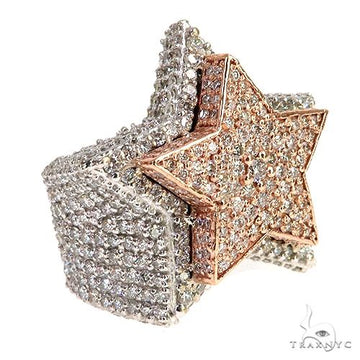Two-tone gold men’s ring with diamond-encrusted star and wide diamond band.
