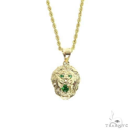 Yellow gold lion head pendant with green emerald eyes and gemstone, on a twisted rope chain