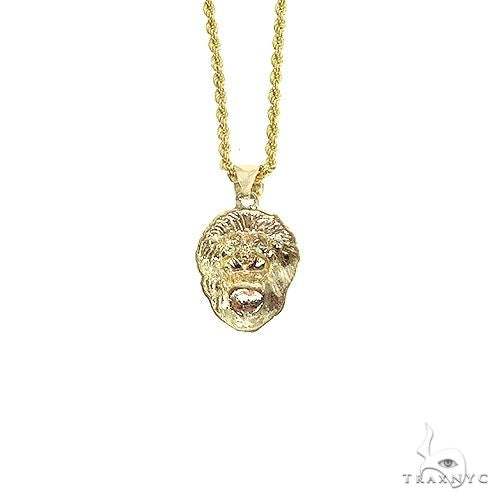 Yellow gold lion head pendant with emerald eyes on a rope chain necklace