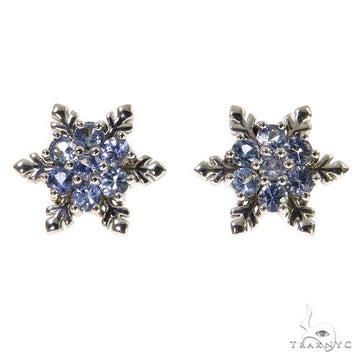 White gold snowflake earrings with round sapphire gemstones in a cluster design.