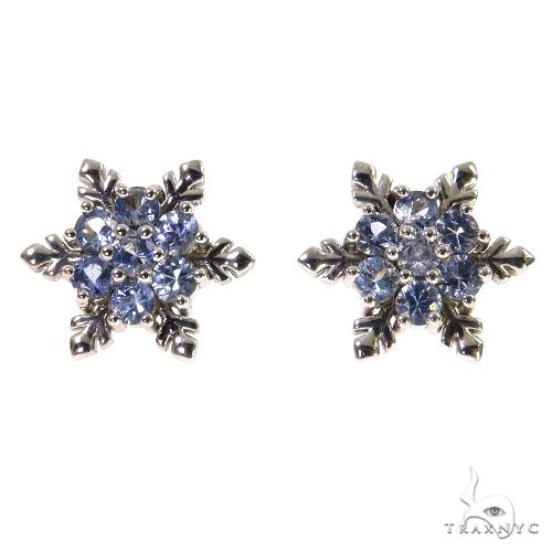 White gold snowflake earrings with round sapphire gemstones in a cluster design