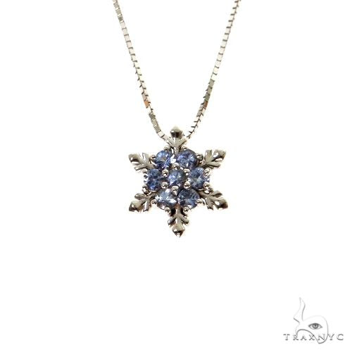 Yellow gold snowflake necklace with six blue sapphire gemstones on fine chain