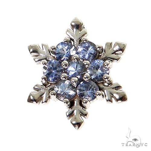 White gold snowflake pendant with round blue sapphire gemstones clustered center