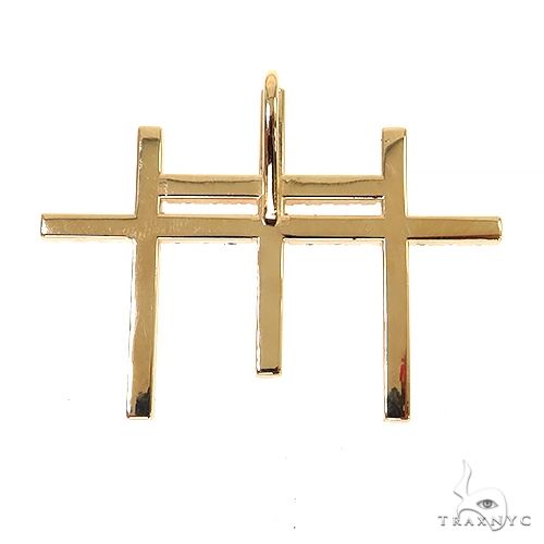 Yellow gold triple cross pendant with sleek, polished finish and integrated bail