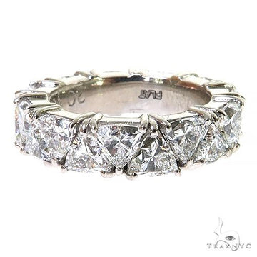 White gold eternity ring with trillion cut diamonds all around band.