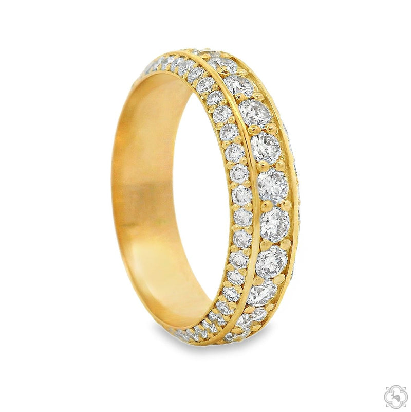Yellow gold triple row diamond eternity band with round-cut diamonds in a classic setting