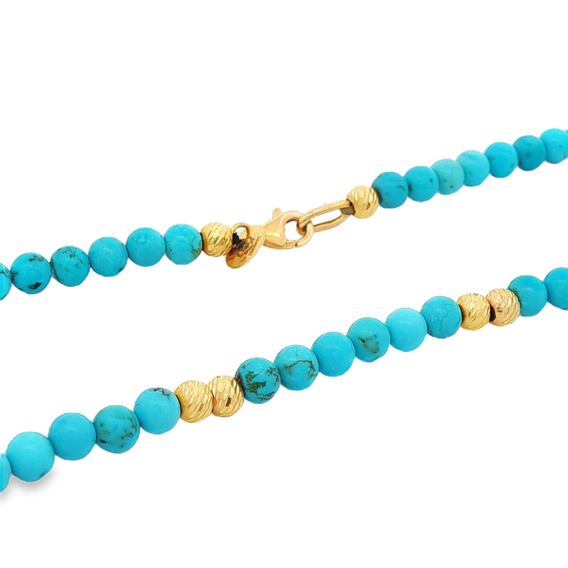 Turquoise bead necklace with gold accents and lobster clasp closure.