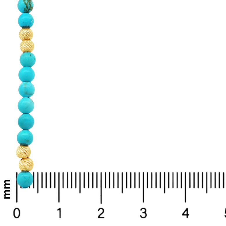Turquoise and ribbed gold round beads strung in alternating pattern on gold chain.