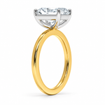 Two-tone 14K gold engagement ring featuring a 2 carat radiant-cut lab grown diamond with four white gold prongs and a polished gold band.