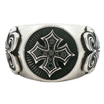 Antique-style silver ring with black cross and detailed side engravings in polished finish.