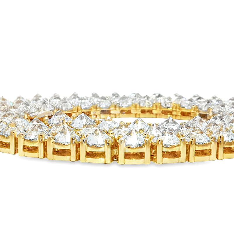 22-inch yellow gold tennis chain with upside down 75 pointer diamonds.