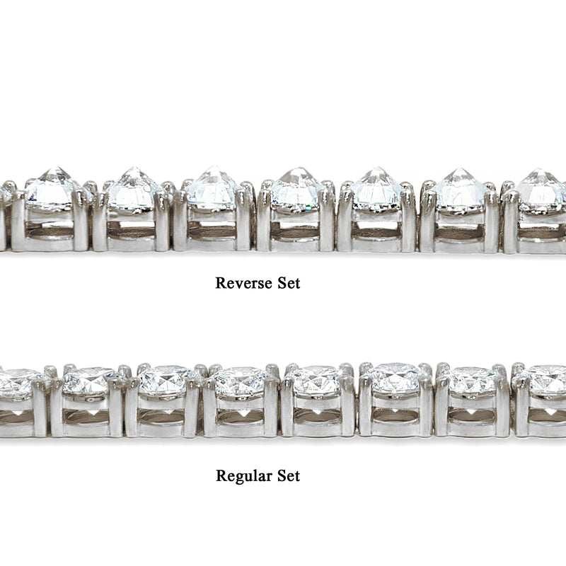 White gold tennis chain with round 75 pointer diamonds, sleek luxury men's jewelry.