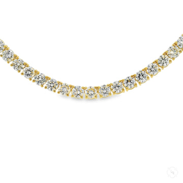 18-inch yellow gold tennis chain necklace with round lab diamonds in prong settings.