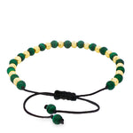 Adjustable bracelet with alternating green malachite and textured gold round beads on black cord.