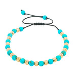 Turquoise and gold bead adjustable bracelet with black woven cord and sliding knot closure.