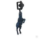 Black horse pendant adorned with blue sapphires and small sparkling diamonds.